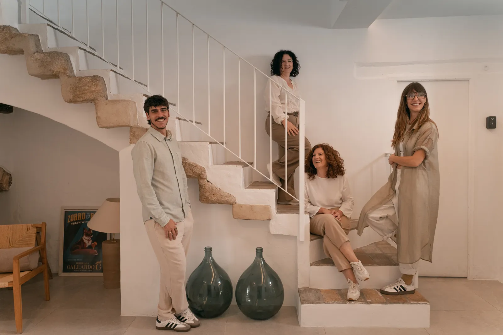 The Manzanilla team: César, Montse, Inés and Ana on the guesthouse staircase